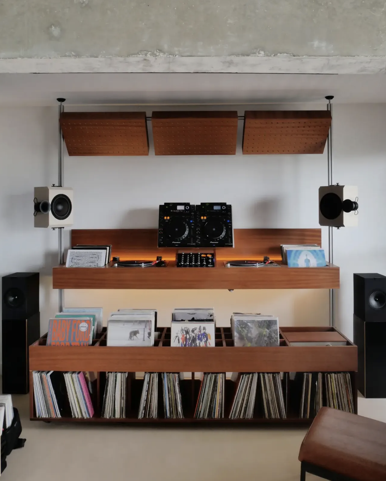 JJ Booth wall-mounted music station with decks, turntables and vinyl